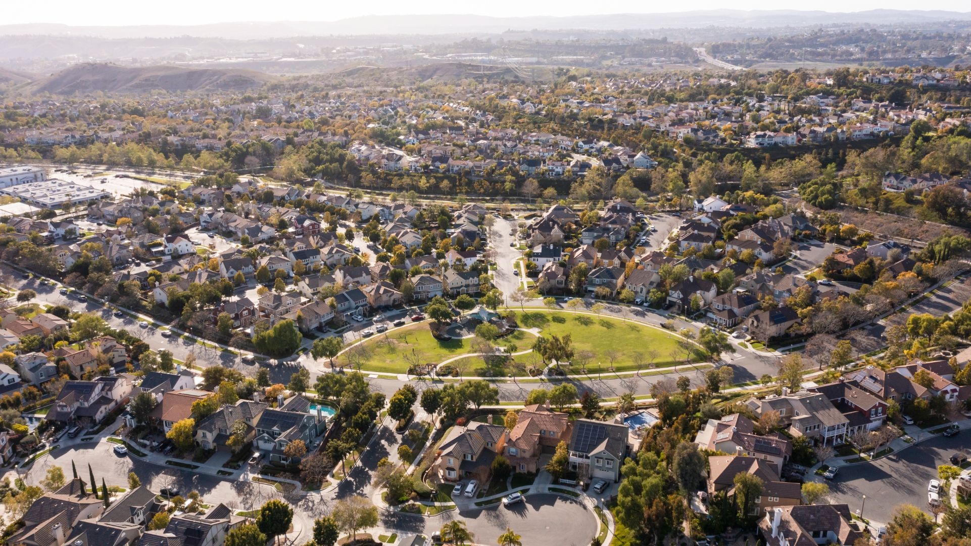 Aerial view of Ladera Ranch master-planned neighborhoods, homes, and a central park