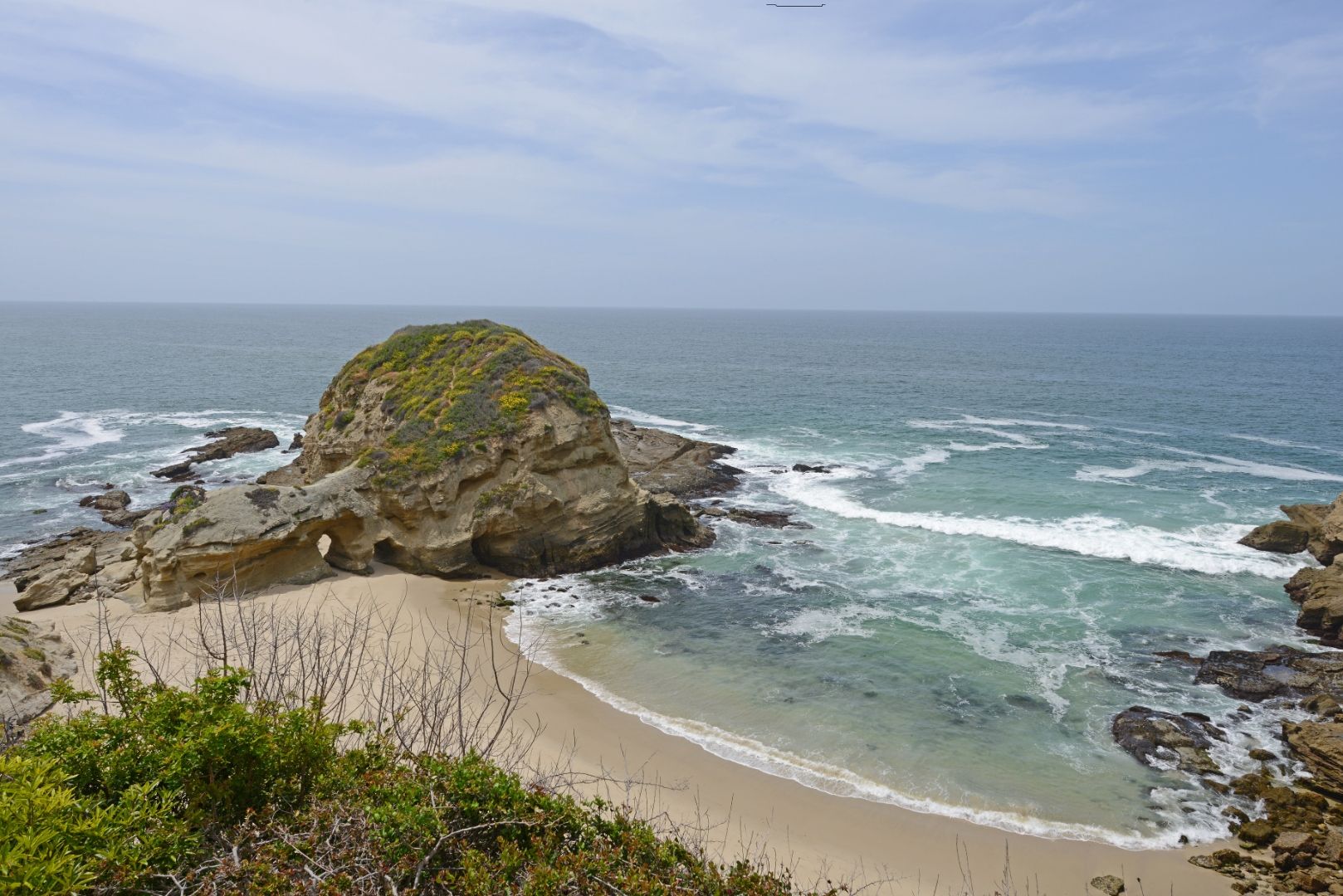 Sunset view of Shell Beach in Newport Coast with the shoreline and coastal bluffs